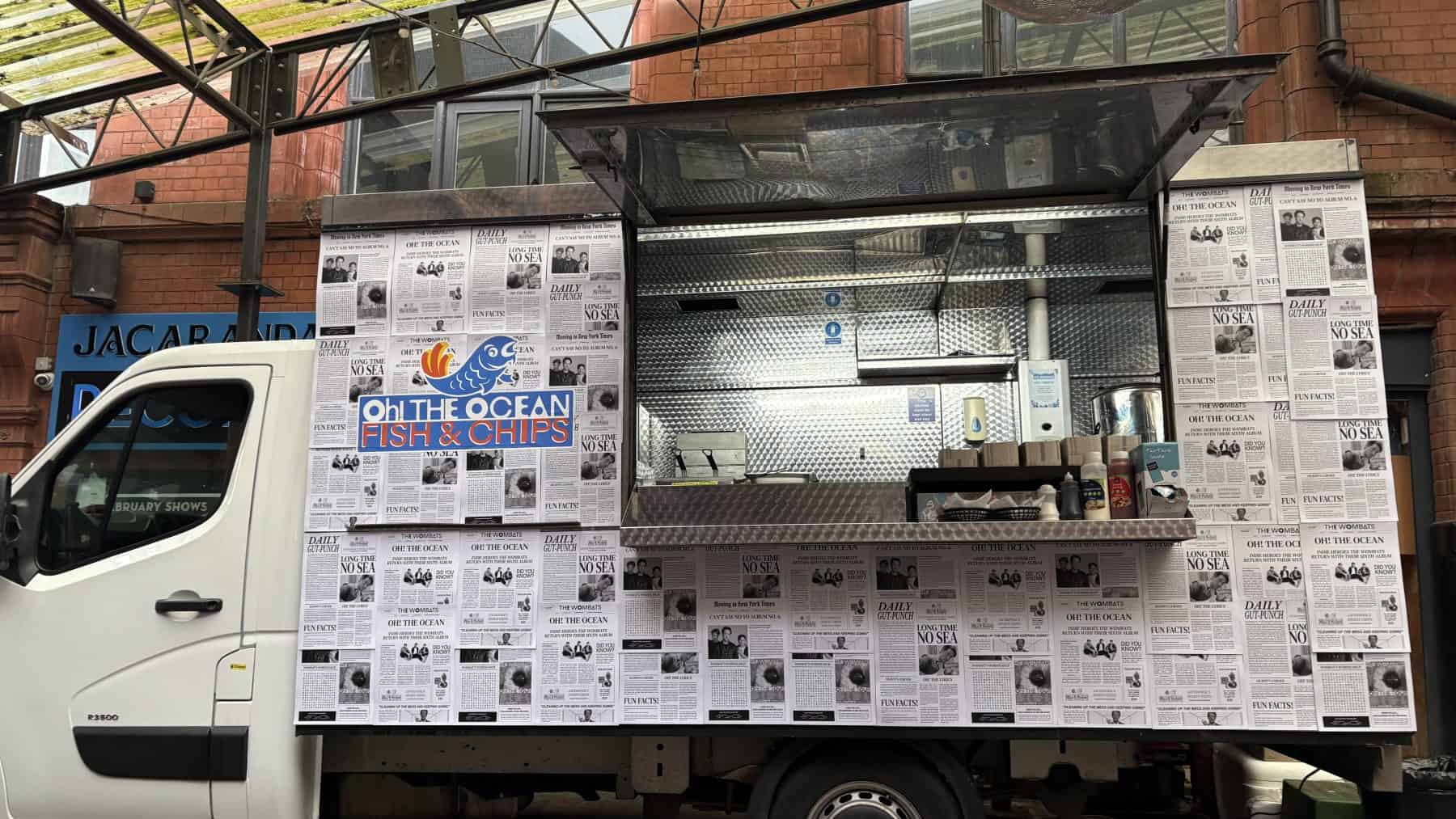 Fresh seafood truck serving fish and chips with NHS-approved hygiene standards in UK.