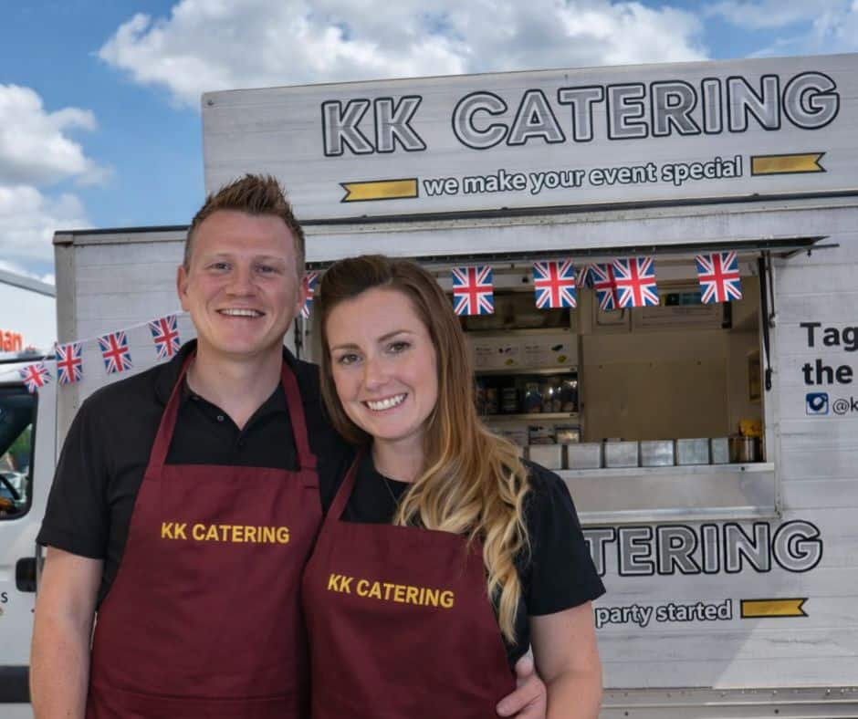 Fresh UK mobile catering food truck with smiling staff at event.
