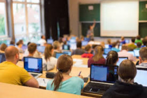 Computer science classes, such as this informatics workshop, train students to use their knowledge of technology in practical applications. [Fotolia/Associated Press] 