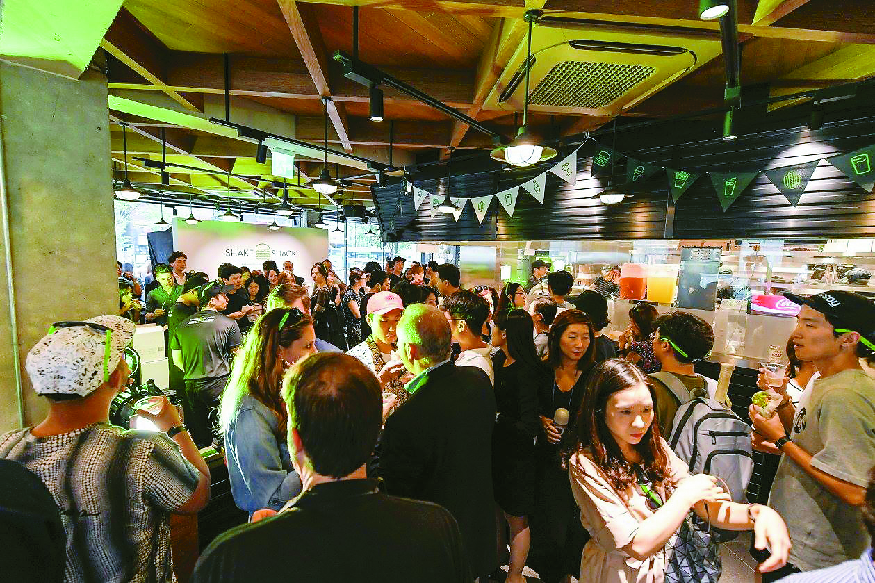 People willingly waited in lines for hours when the first Shake Shack opened in Seoul, Korea.