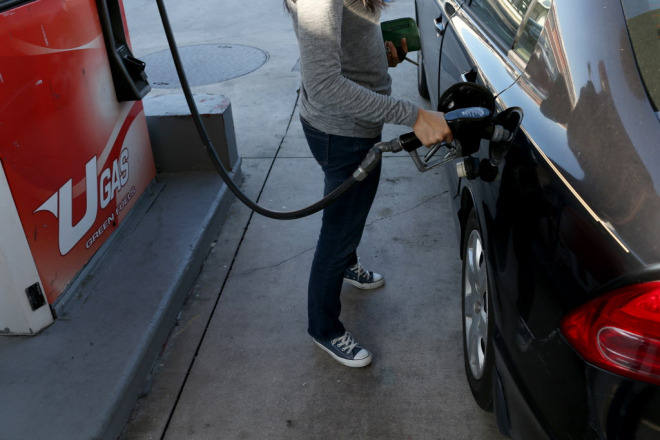 MIAMI, FL - DECEMBER 08: A customer puts gas into a vehicle at the U-gas station on December 8, 2014 in Miami, Florida. According to the AAA Monthly Gas Price Report, todays national average price of gas is $2.75 per gallon, which is the lowest average since Oct. 5, 2010. (Photo by Joe Raedle/Getty Images)