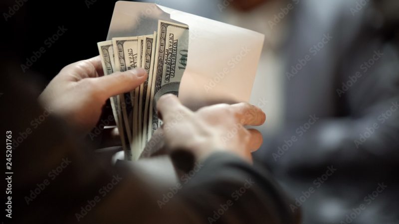 Envelope with dollars, lady giving bribe to politician to cover illegal business
