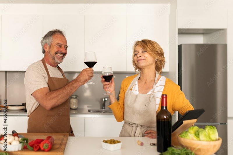 Senior couple enjoying and cooking together at home