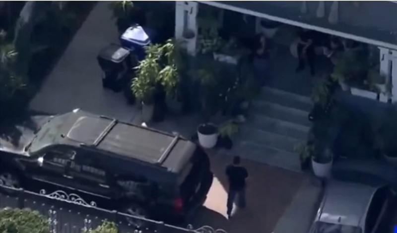ICE agents conduct early morning raids to arrest undocumented immigrants in South LA area on February 27.  [Screen capture from KTLA5]