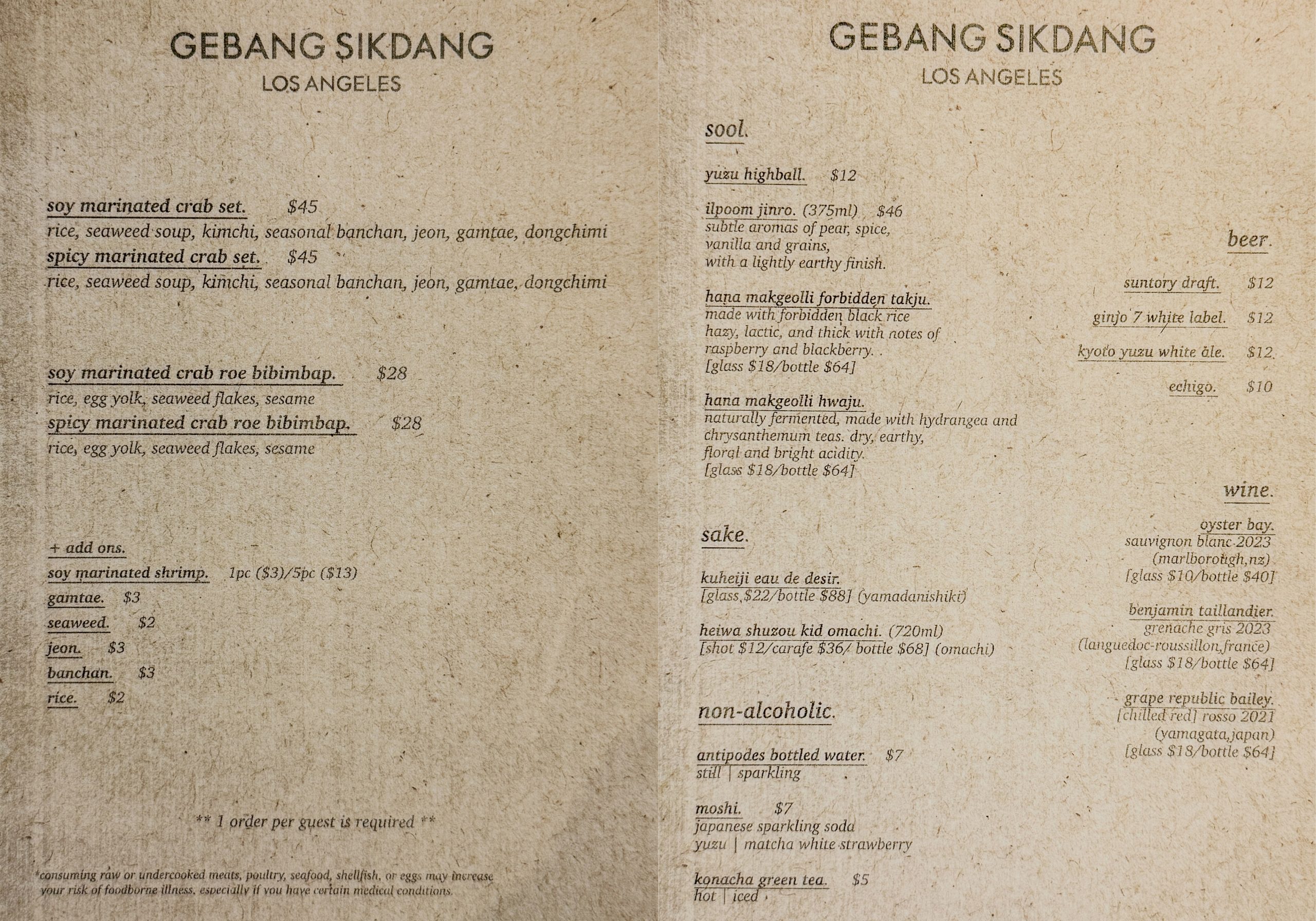 GEBANGSIKDANG LA menu featuring its signature Korean dishes on the left, including soy sauce-marinated crab and bibimbap, and a drink selection on the right, offering soju, makgeolli, sake, beer, wine, and non-alcoholic beverages. [Yoonjae Jung, The Korea Daily]