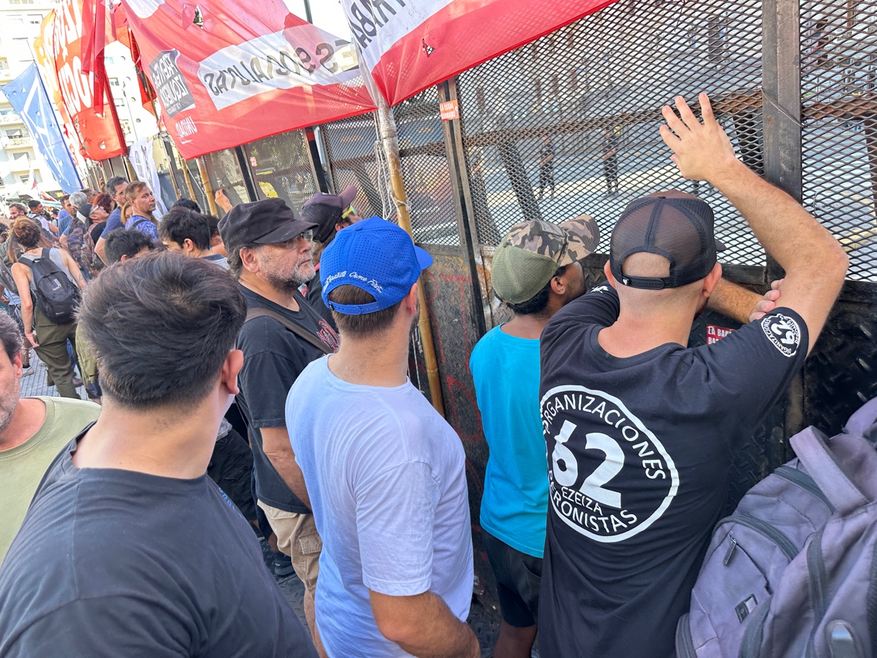 Protesters stand inches from steel barricades in Buenos Aires.