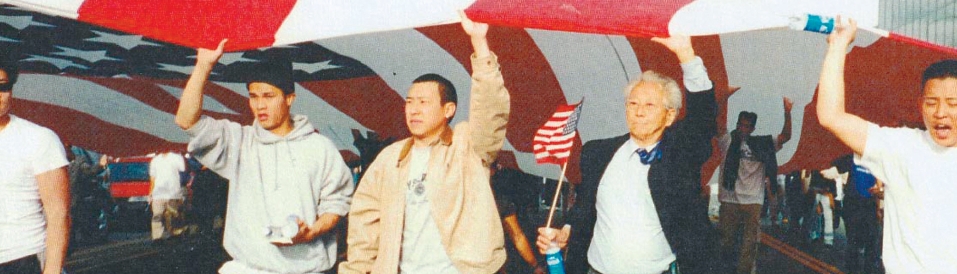 Korean American community march with U.S. flags after LA riots