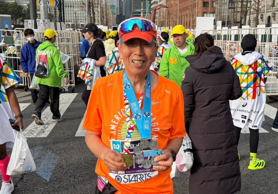 Howard Lee displays his medals.