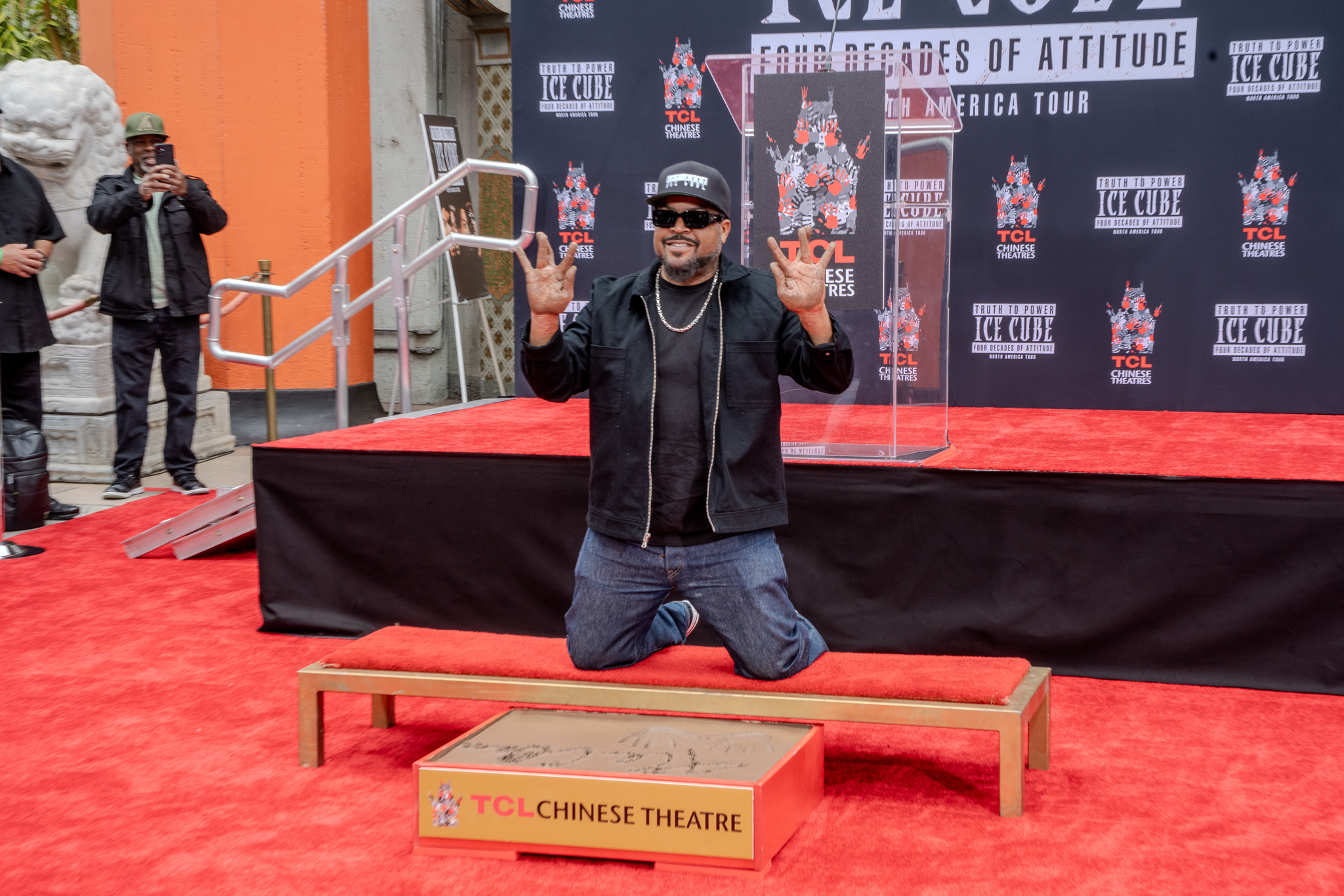 Ice Cube raises hands after TCL Chinese Theatre handprint