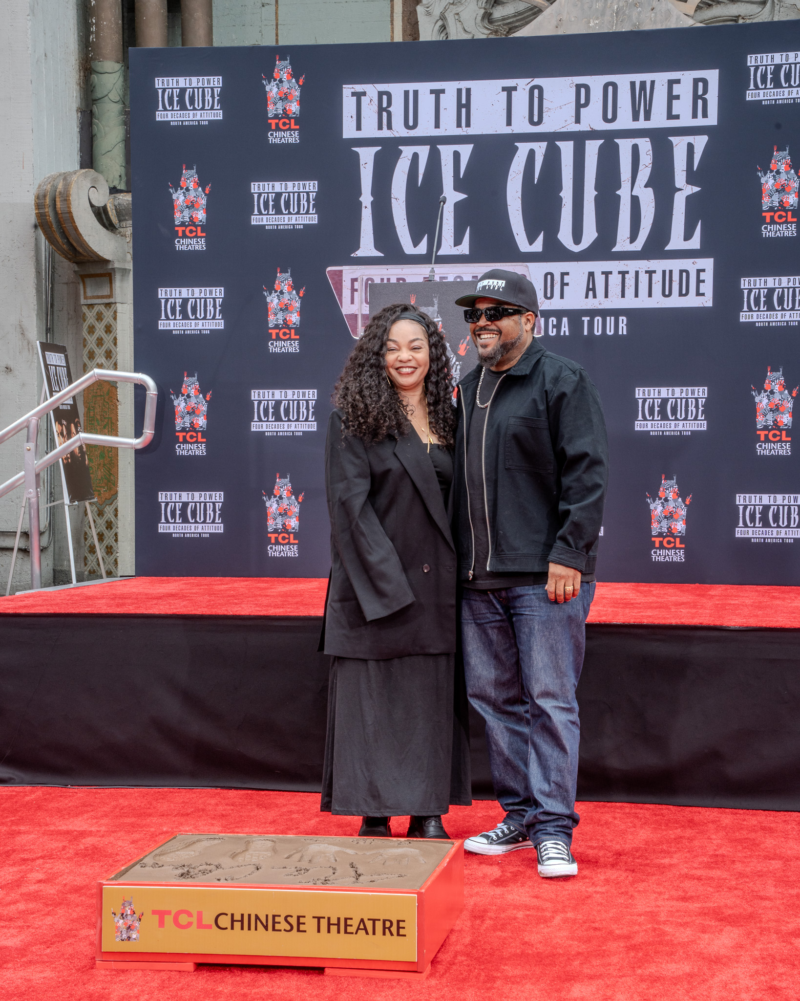Ice Cube TCL Chinese Theatre pose with wife after cement ceremony