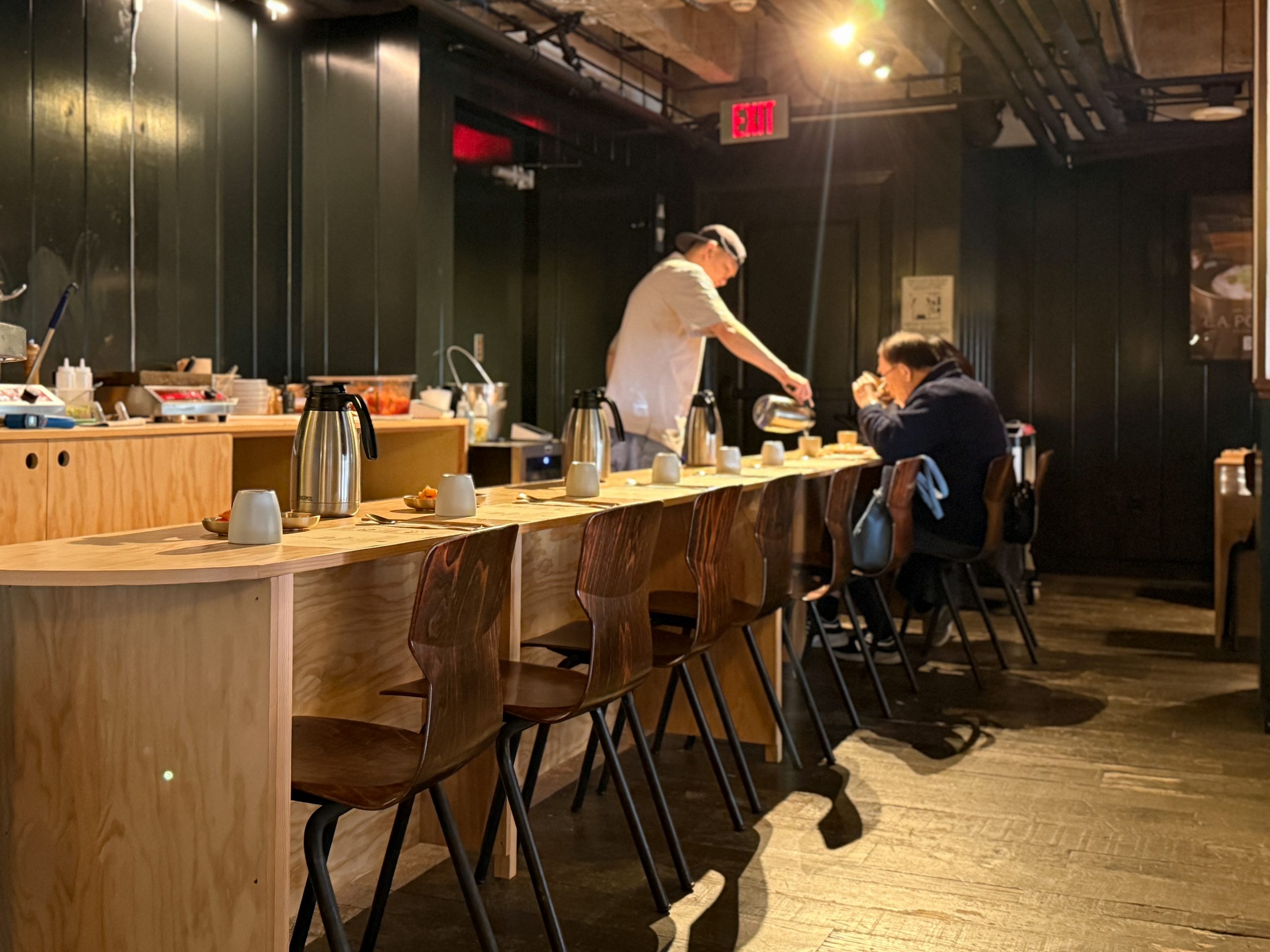 Empty bar-style seating at Okdongsik LA pop-up