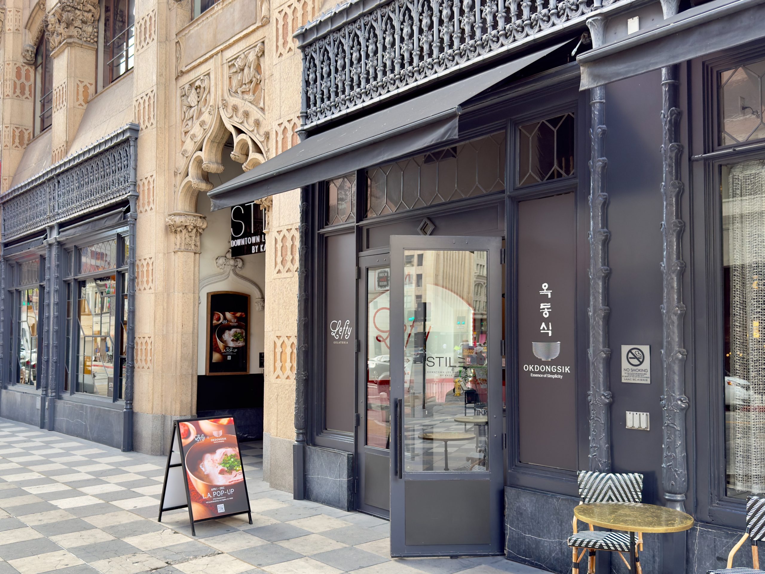 STILE Hotel exterior with Seoul Michelin Bib Gourmand Okdongsik sign in Downtown LA