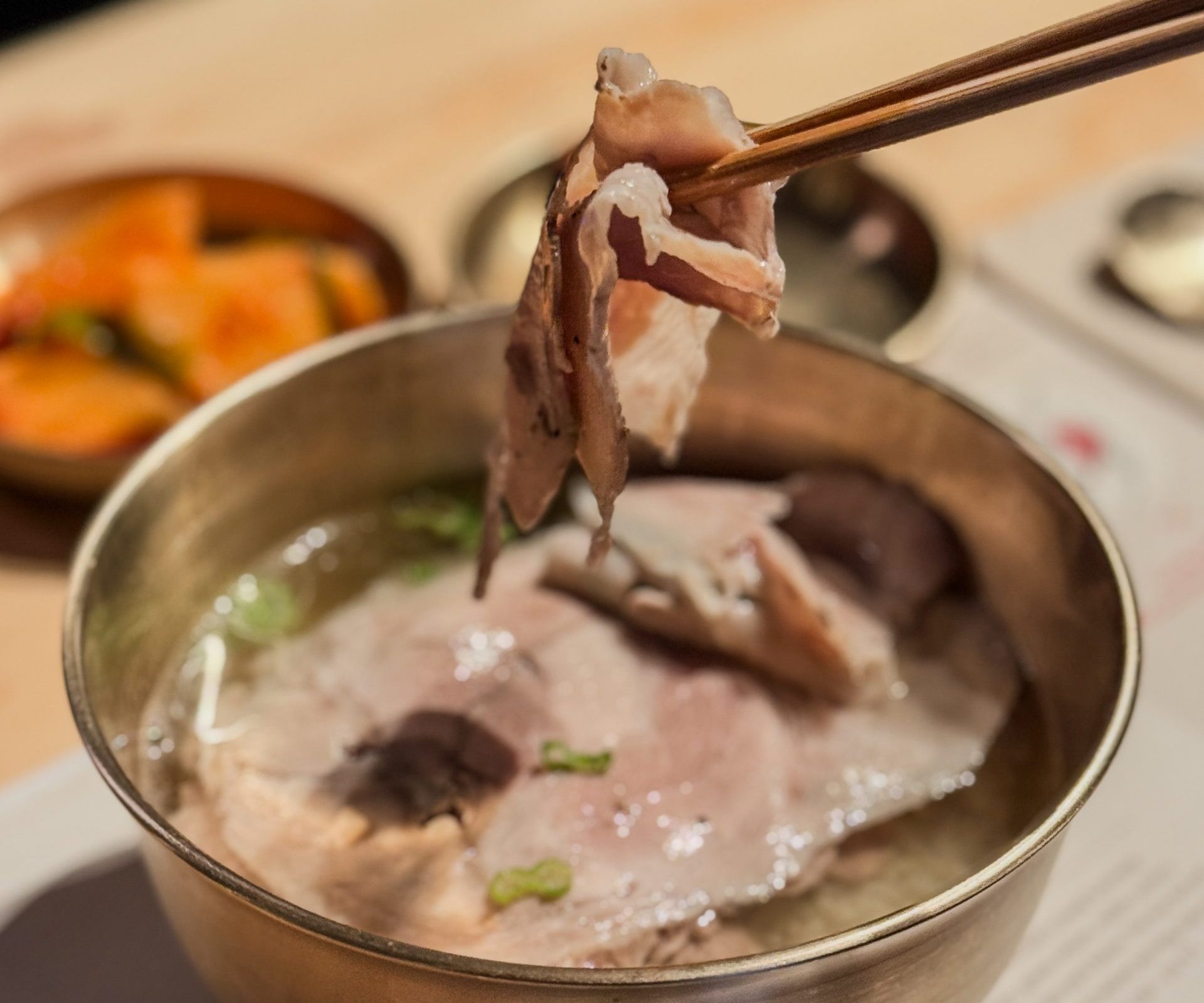 Holding pork from Seoul Michelin Bib Gourmand Dweji-Gomtang