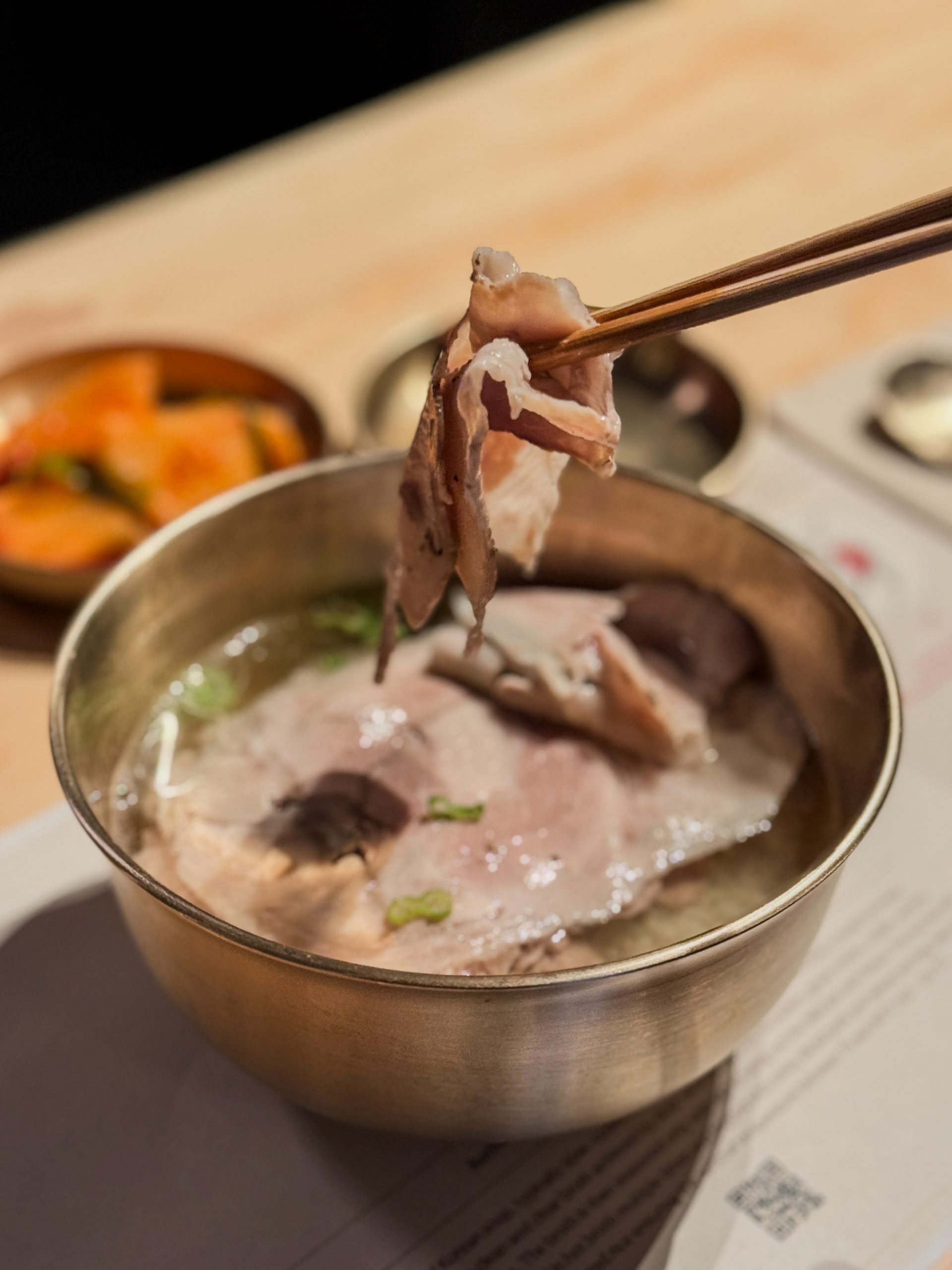Holding pork from Seoul Michelin Bib Gourmand Dweji-Gomtang