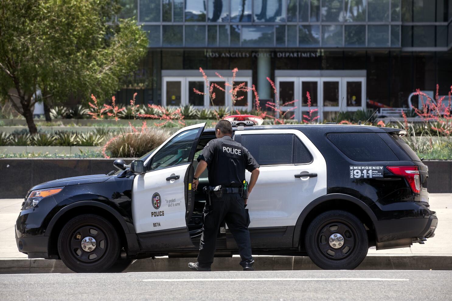 LAPD officer enters patrol car in downtown Los Angeles amid wrongful detention lawsuit
