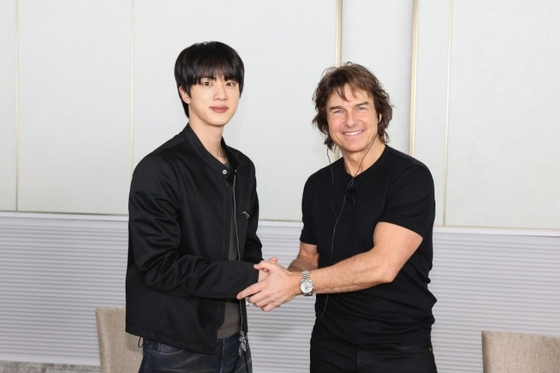 BTS's Jin, left, and actor Tom Cruise met for a recent episode of ″Run Jin″ [LOTTE ENTERTAINMENT]