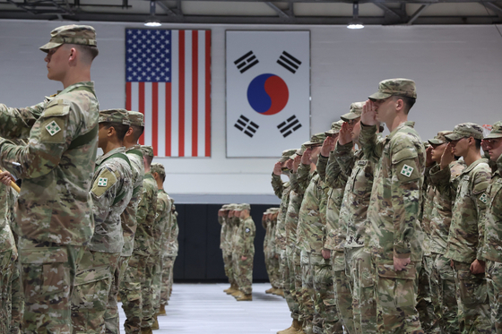 U.S. soldiers salute the American flag at Camp Casey in Dongducheon, Gyeonggi, on July 6, 2023. [YONHAP]