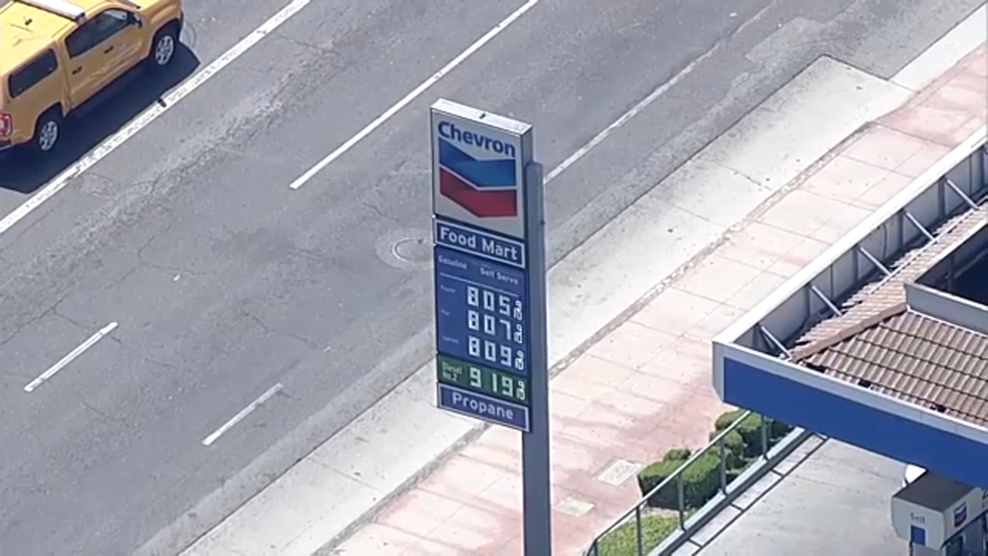 Chevron gas station sign showing prices over $8, illustrating California gas prices forecast