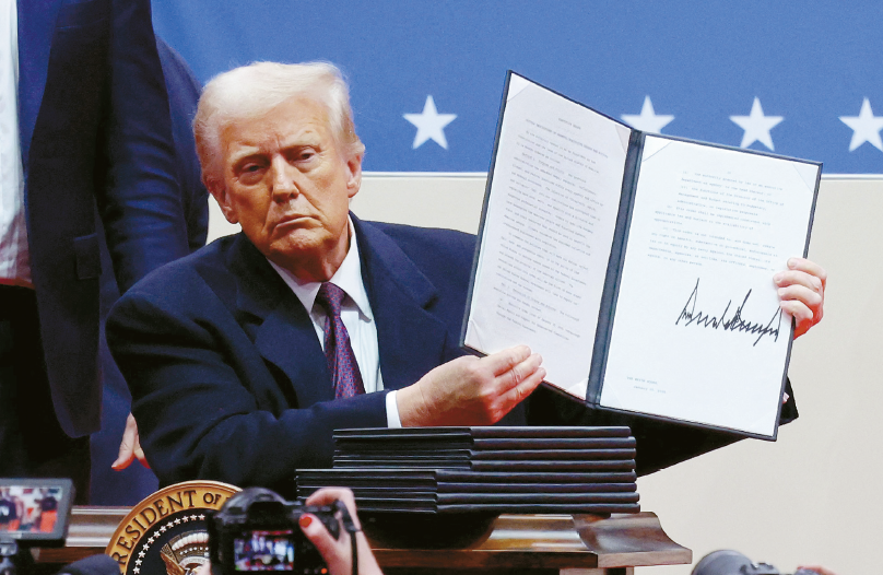 Donald Trump displays executive order on first day in office as part of Harvard DEI conflict rollback