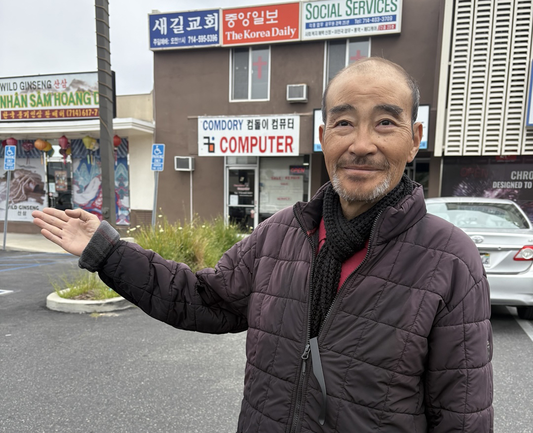 Korean American cobbler Romano Kim stands outside his former repair shop in Garden Grove after retiring