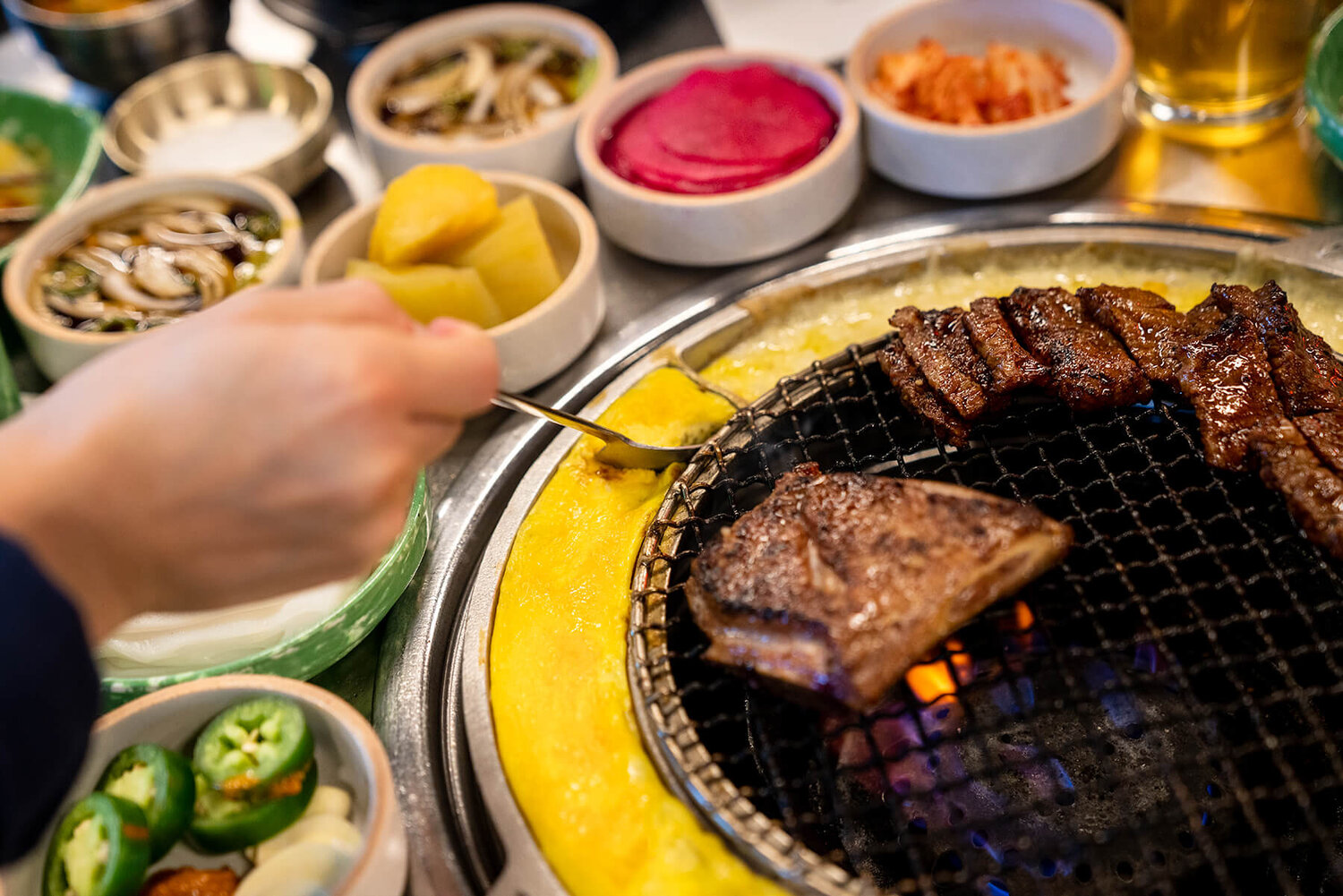 Baekjeong returns to Koreatown with grilled meat, cheese, and side dishes