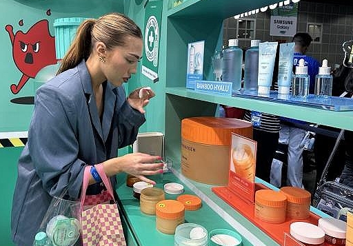 woman testing K-beauty products amid cross-border sales boom