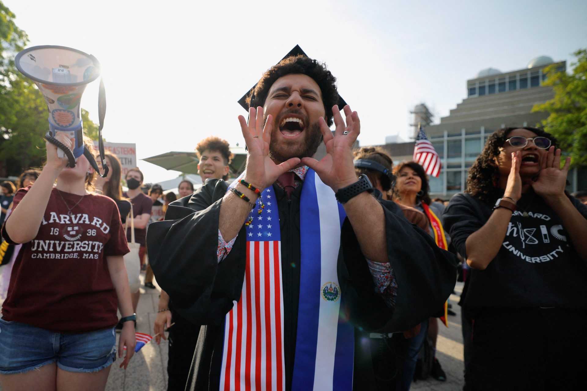 A student wearing a U.S.-El Salvador stole joins the “Harvard Stand United” rally for international students at Harvard University on May 27, 2025. [REUTERS]