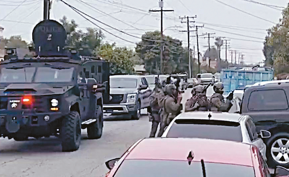 ICE immigration agents in tactical gear enter South LA home during raid
