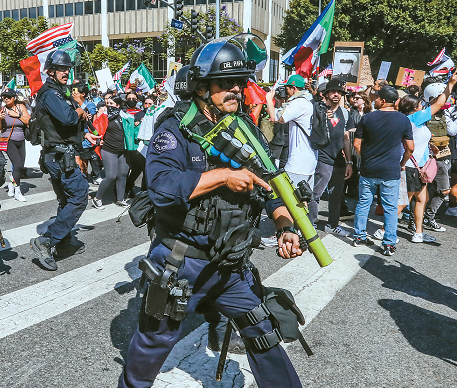 LAPD officers aiming rubber bullet launchers at protesters during downtown LA demonstration