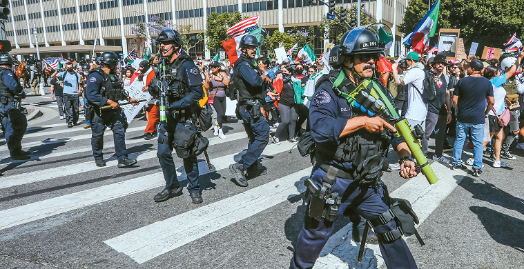 LAPD officers aiming rubber bullet launchers at protesters during downtown LA demonstration
