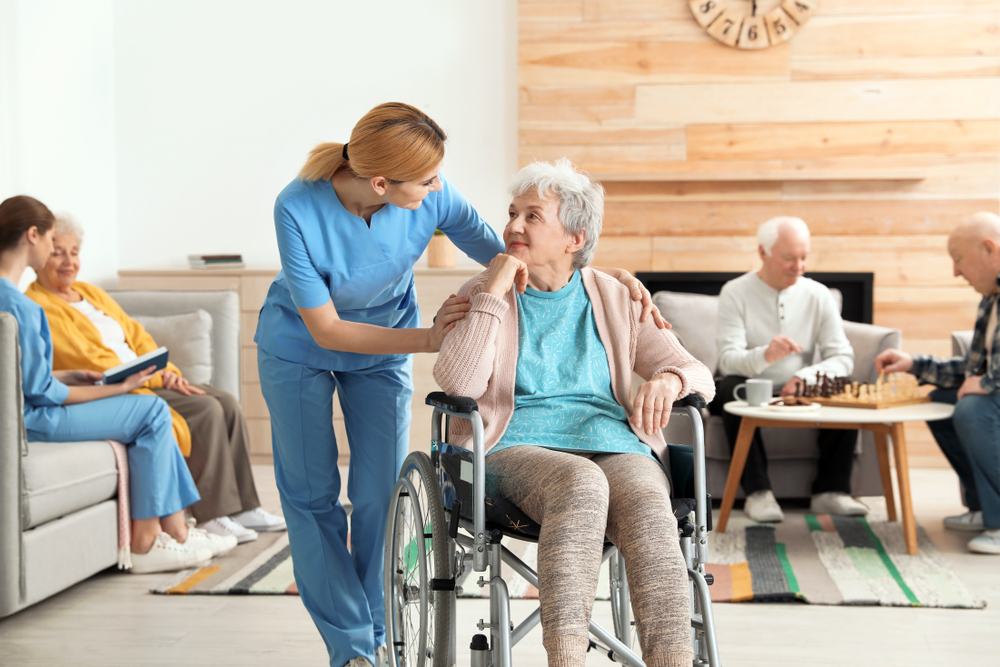 Nurses assisting elderly residents inside a retirement home facility