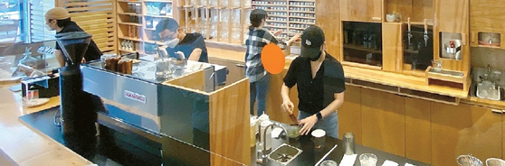 Baristas working behind the counter at Document Coffee Bar in Koreatown Los Angeles