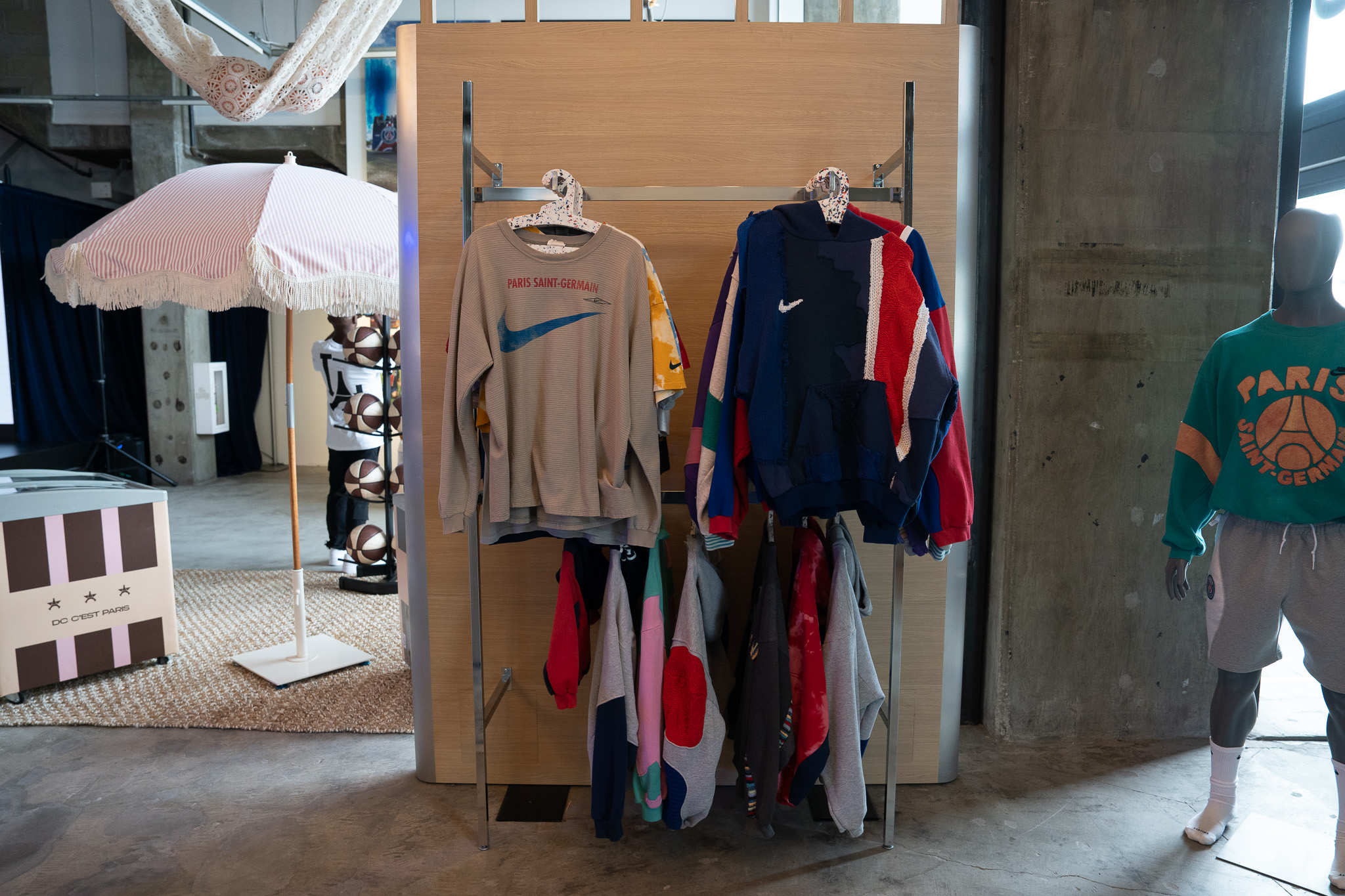 Limited-edition PSG House hoodie and T-shirt with exclusive branding on display