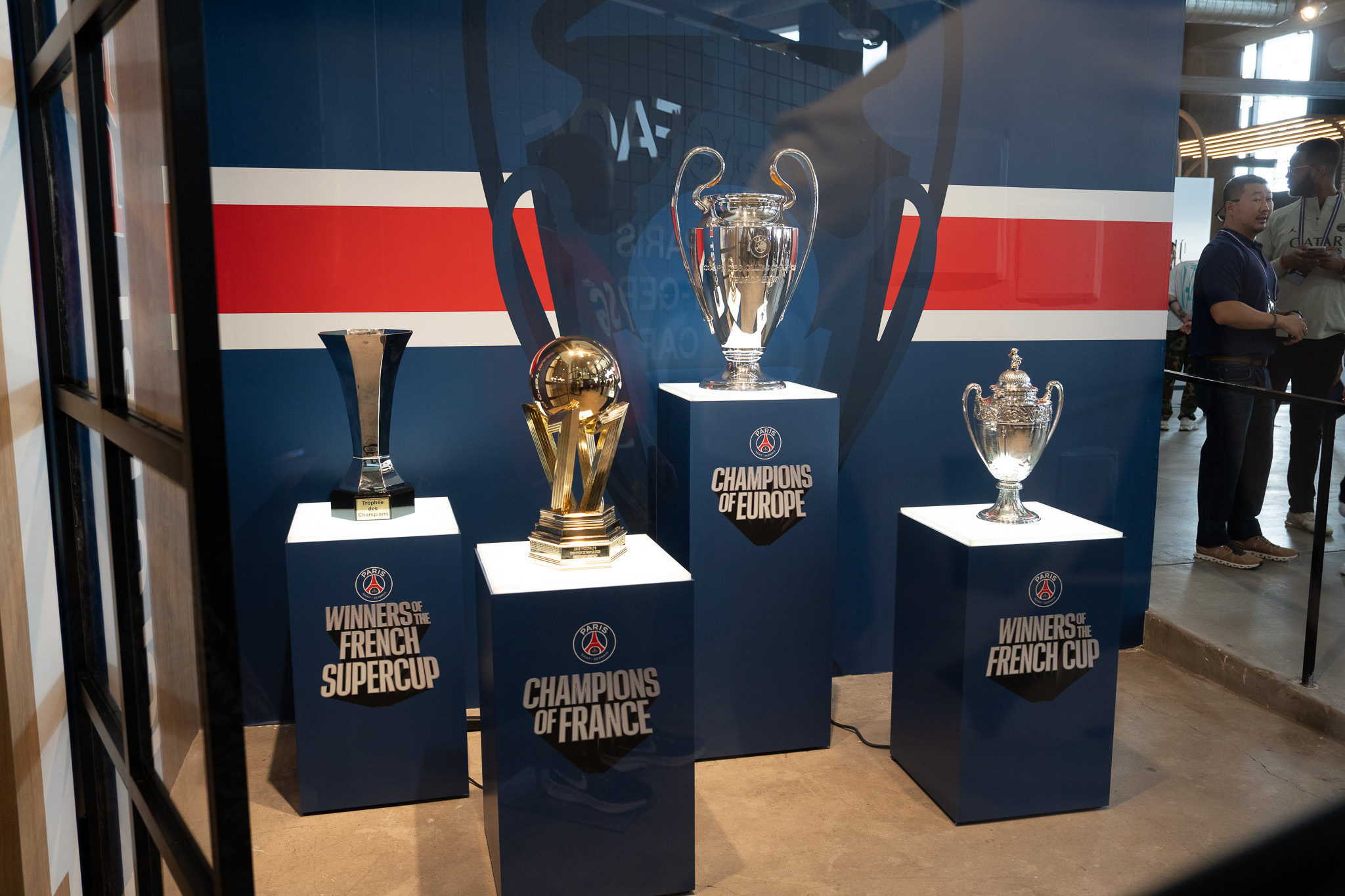 PSG House trophy section featuring newly won Champions League cup in LA pop-up