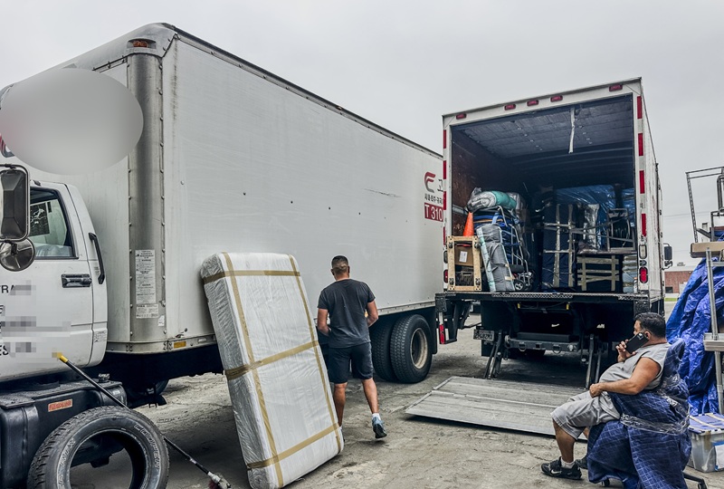 Truck drivers rest at a Gardena trucking company as container volume drops due to tariff policies. [Sangjin Kim, The Korea Daily]