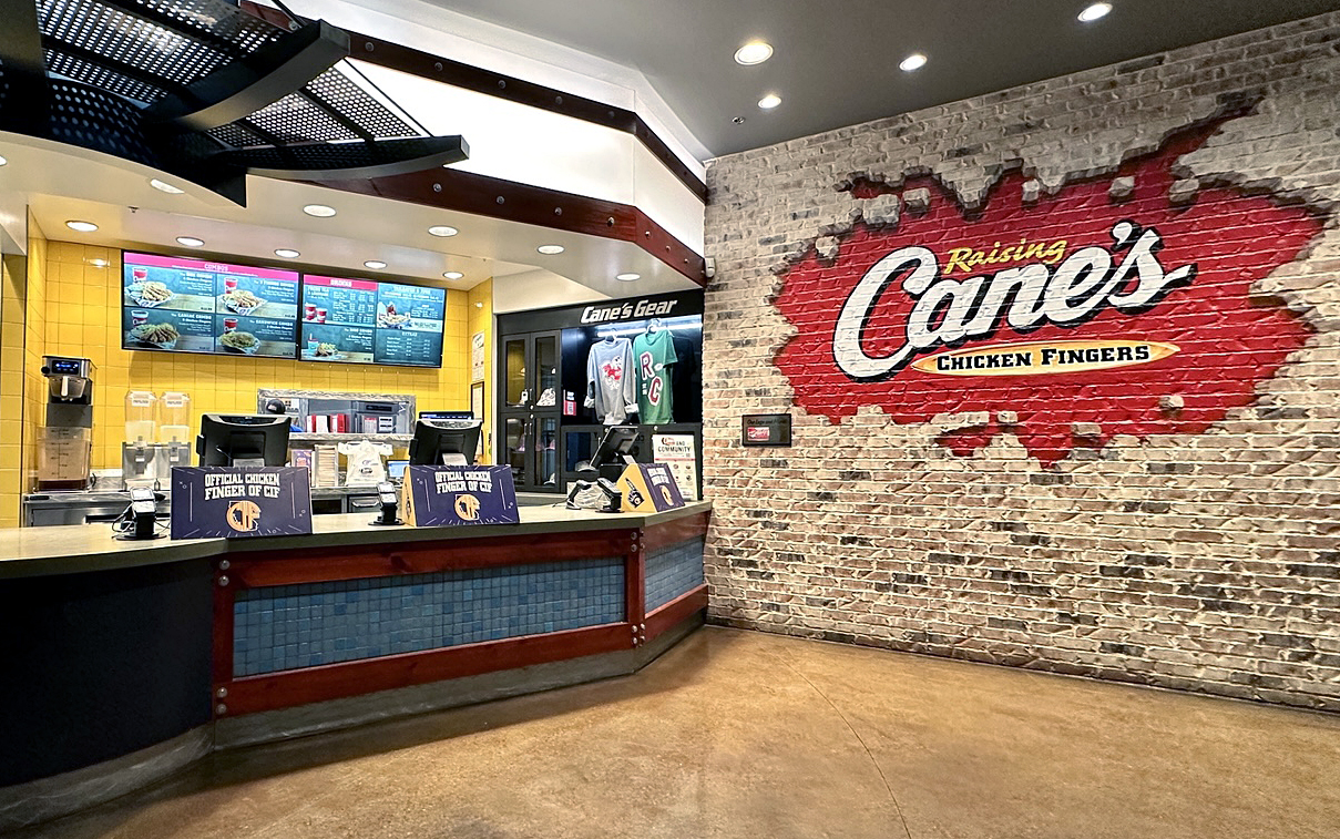 Raising Cane’s interior with customers dining at a Los Angeles location, highlighting the chicken restaurant chain’s rapid U.S. expansion