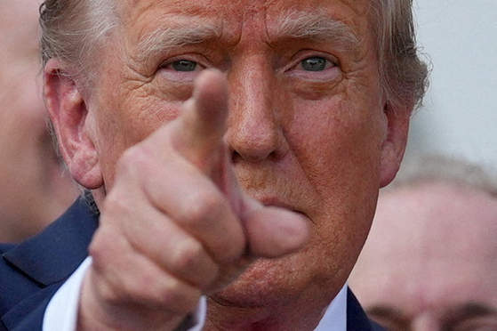 U.S. President Donald Trump gestures after signing a sweeping spending and tax legislation at the White House in Washington on July 4. [REUTERS]