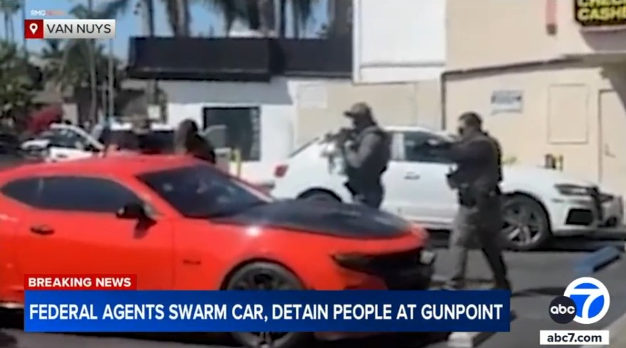 ICE raids in Van Nuys strip mall on September 9 with officers pointing rifles during enforcement