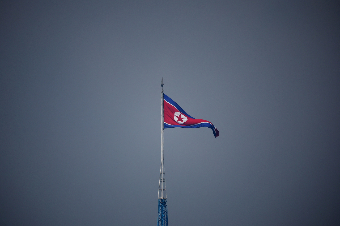 A North Korean flag flutters at the propaganda village of Gijungdong in North Korea, in this picture taken near the truce village of Panmunjom inside the demilitarized zone (DMZ) in South Korea on July 19, 2022. [REUTERS]