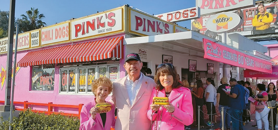 Richard Pink with his family in front of the Pink’s Hot Dogs flagship, highlighting the Pink’s Hot Dogs Korea franchise registration.