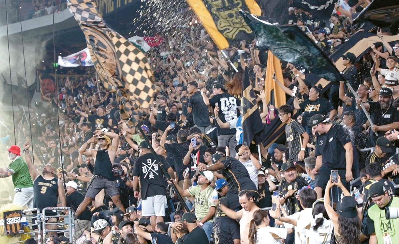 Fans in LAFC’s 3252 section celebrate Son Heung-Min’s stoppage-time goal at BMO Stadium