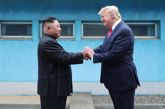 North Korean leader Kim Jong-un and U.S. President Donald Trump shake hands during their summit at the truce village of Panmunjom near the inter-Korean border on July 1, 2019. [RODONG SINMUN]