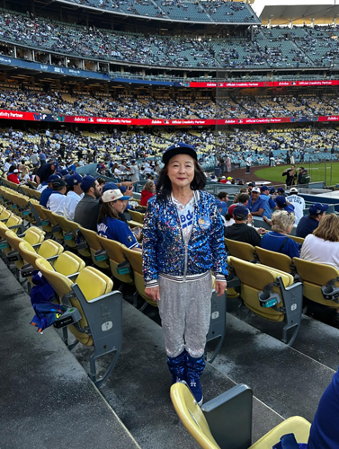 Dodgers Mom Pasadena bakery owner Aeja Kwon at Dodger Stadium supporting the team.