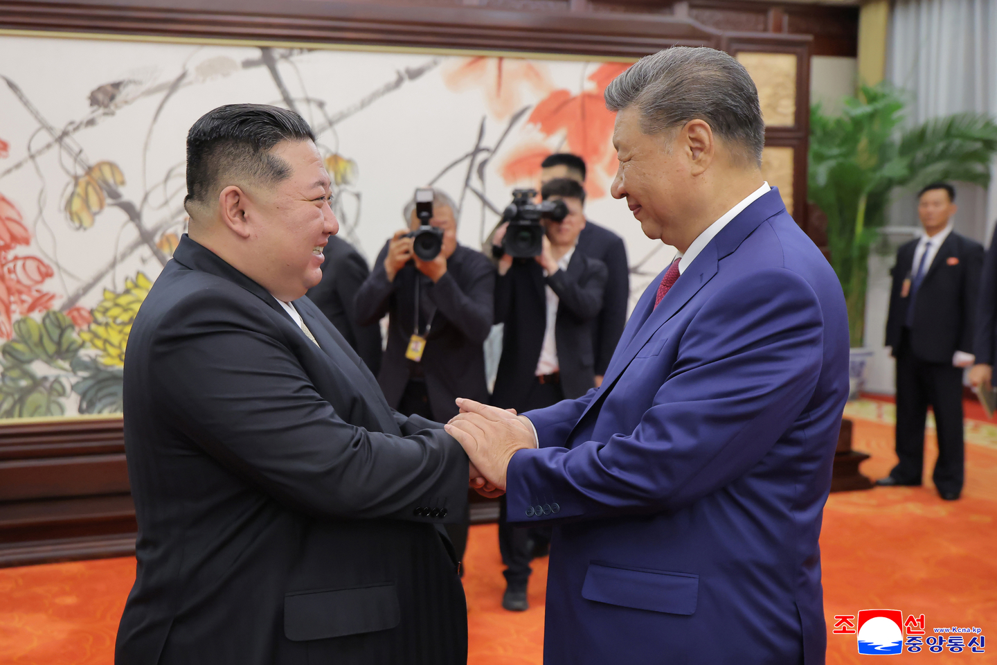 Chinese President Xi Jinping, right, shakes hands with North Korean leader Kim Jong-un during a meeting at the Great Hall of the People in Beijing, China, on Sept. 4, in this photo released by North Korea's state-run Korean Central News Agency. [KOREAN CENTRAL NEWS AGENCY]
