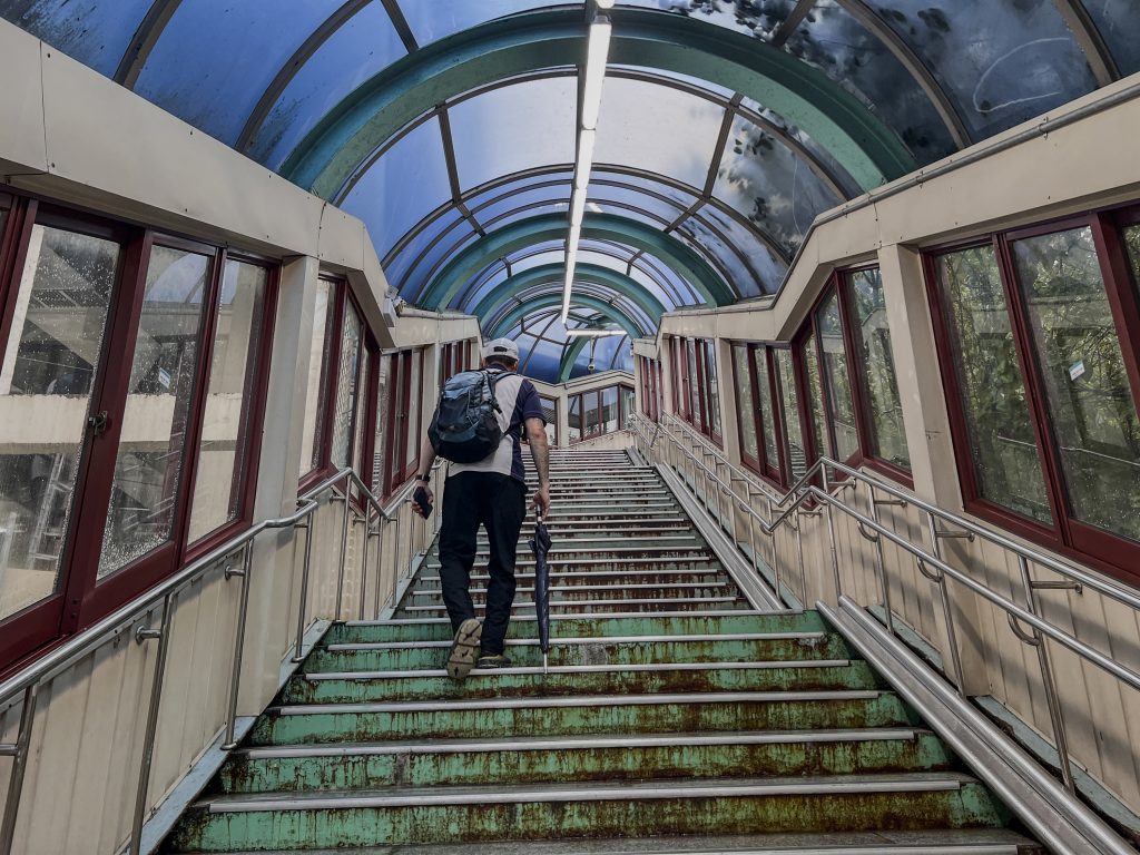 S.J. walks up a staircase in Seoul after an interview