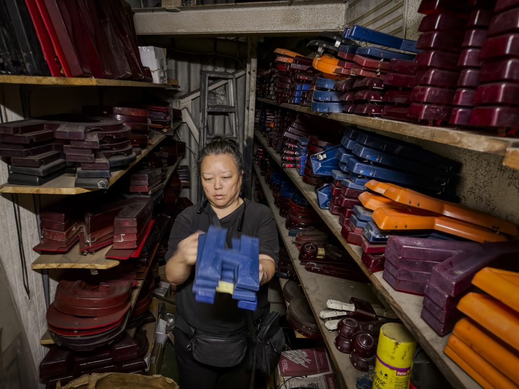Judy Kim sorting marquee letters inside Gardena Cinema storage room
