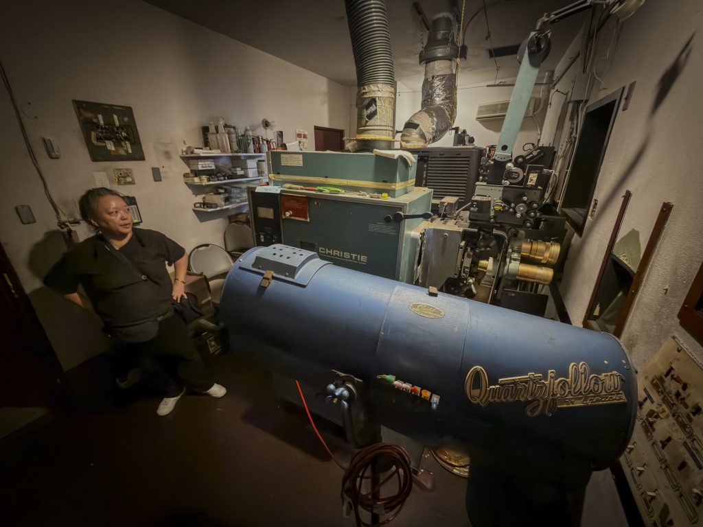 Projection booth with film and digital projectors at Gardena Cinema