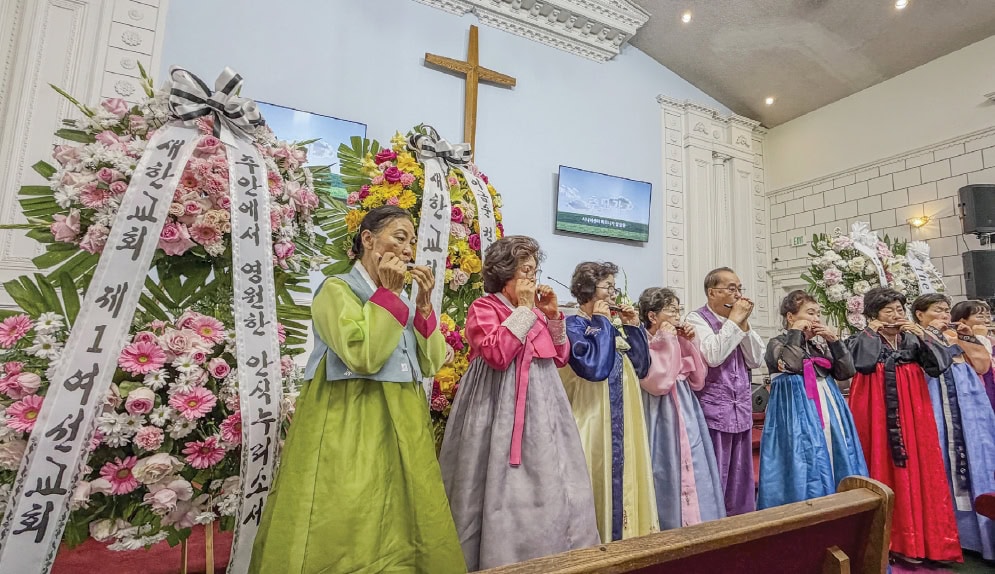 Senior center harmonica group performing memorial song at Keum-soon Lee funeral in Los Angeles