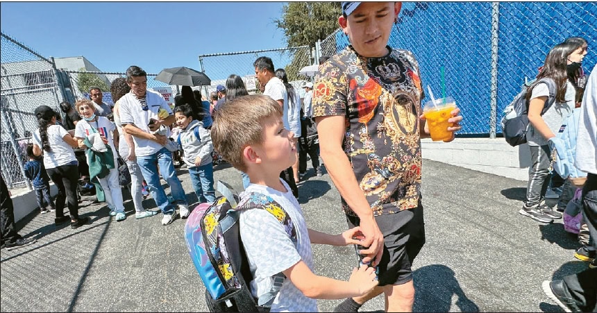 Students walking out of Wilton Place Elementary School after Los Angeles Unified School District reached a wage deal to avoid a strike in Los Angeles