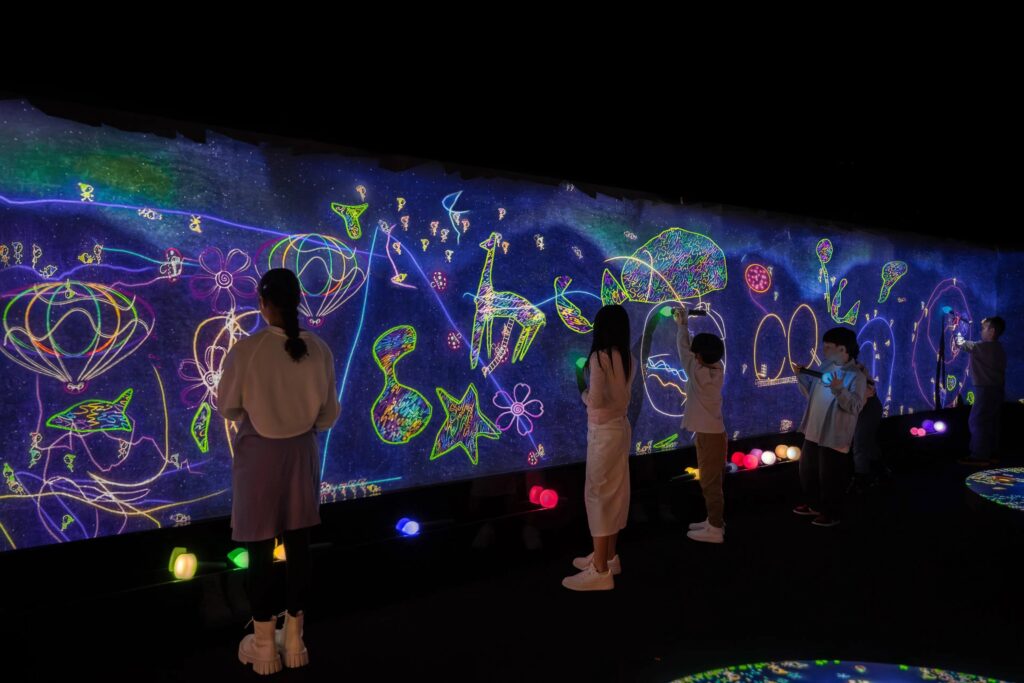 Children exploring interactive digital art at teamLab Planets Toyosu in the Tokyo Family Itinerary
